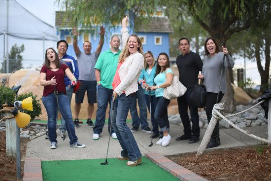 Adults and teens having fun at a group event at a family amusement center in Murrieta